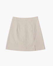 Elizabeth | Rücken-Reißverschluss Minirock mit dezentem Schlitz – Beige
