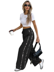 Damen Weite High‑Waist Loungehose mit Kordelzug und kontrastierenden Seitenstreifen Nord Taschen – Schwarz
