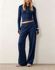 Damen Zweiteiliges Loungewear-Set geripptes Crop-Kapuzenoberteil mit Reißverschluss und Daumenloch sowie weiter Jogginghose Nord Taschen – Marineblau