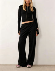 Damen Zweiteiliges Loungewear-Set geripptes Crop-Kapuzenoberteil mit Reißverschluss und Daumenloch sowie weiter Jogginghose Nord Taschen – Schwarz
