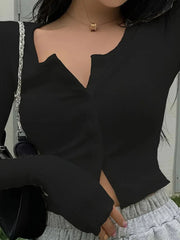 Damen Figurbetonter gerippter Cropped-Cardigan mit V-Ausschnitt und Knopfleiste Nord Taschen – Schwarz