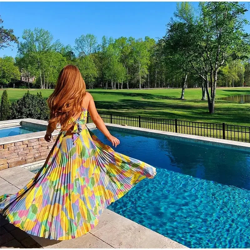 Bedrucktes Sommerkleid mit tiefem Ausschnitt und Schleifendetail – Vivienne