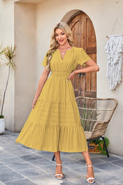 Astrelle - Strukturiertes, stufiges Maxikleid – Senfgelb