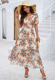 Liliana – Boho Maxikleid mit Blumenprint, V-Ausschnitt & Smoktaille – Aprikose